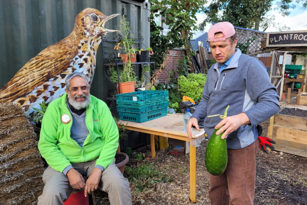 Guessing the weight of the heaviest harvested gourd recording during Urban Harvest. Credit: Loughborough Farm