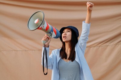 Campaigner on a megaphone. Credit: Thirdman | Pexels