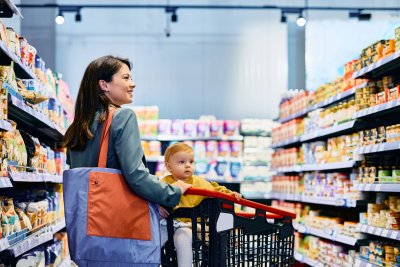 A woman shopping with a child.. Credit: Drazen Zigic: iStock