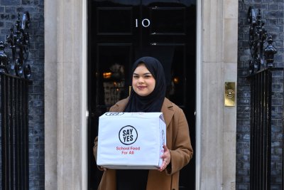 Naema outside Number 10, delivering the Say Yes petition